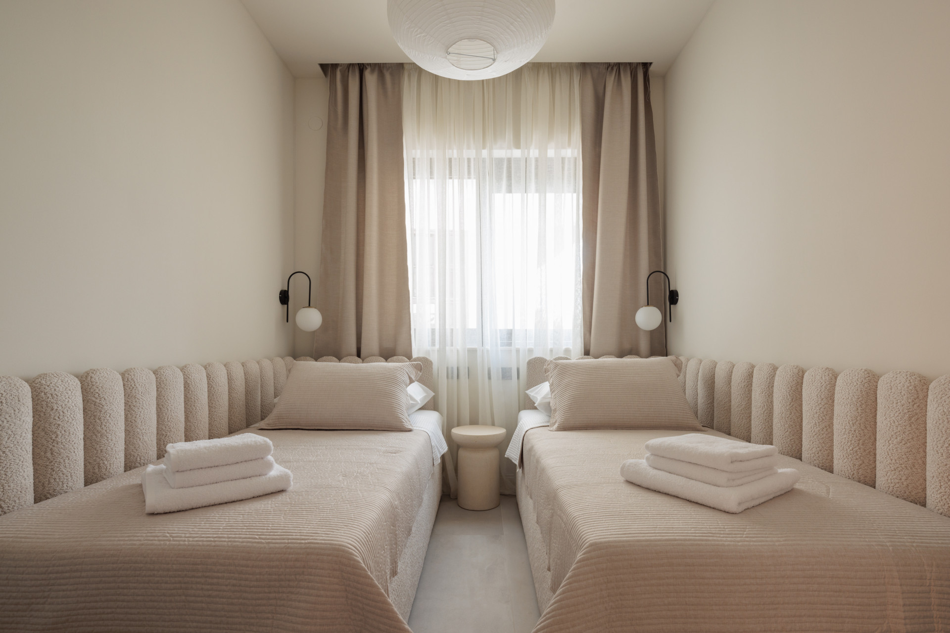 Villa Casa NoTa twin bedroom with soft neutral design